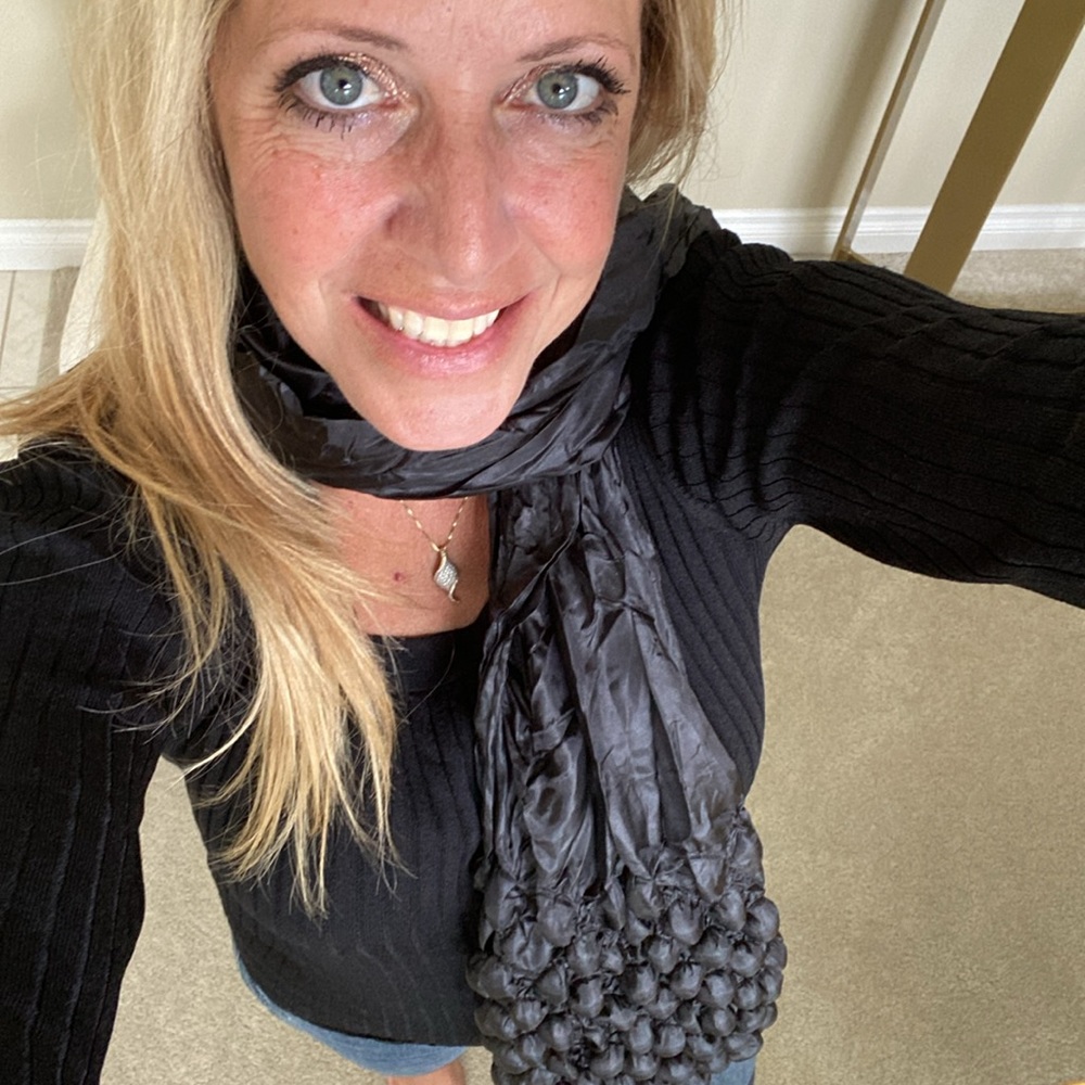 Scarf: Lightweight black scarf with bubble design at ends.